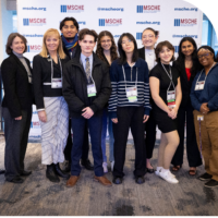 Annual Conference attendees in front of MSCHE banner